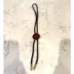 vintage brown lucite bolo tie with an embedded gold leaf design western rodeo